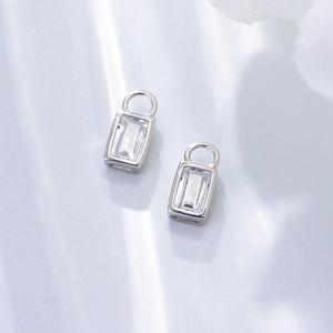 Detailed close-up of emerald-cut zircon pendants on s925 silver earring charms