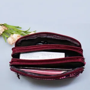 Three-layer burgundy nylon crossbody phone bag with multi-zipper compartments for women
