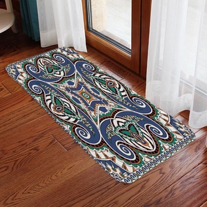 Bohemian runner rug with ethnic patterns on dark wood floor near window