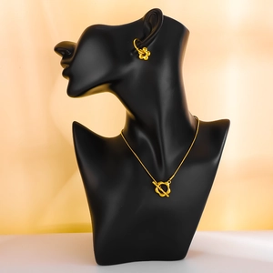 Gold metallic 3D flower OT buckle necklace and earrings set on black display