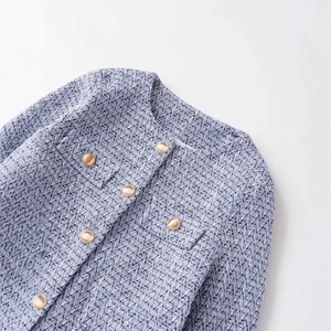 Blue tweed jacket for women featuring elegant gold buttons and classic woven texture