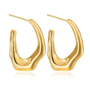 Detail of gold liquid lava style stainless steel earrings with polished wavy surface