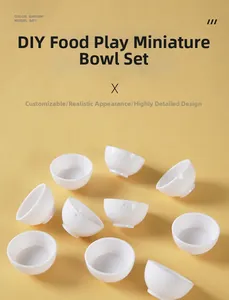 Flat lay of miniature white resin bowls for DIY food play scenes on yellow backdrop