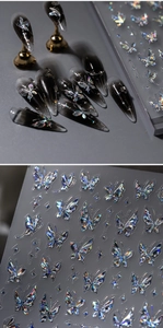 Macro view of holographic butterfly nail stickers showing 3D laser effect on dark nails