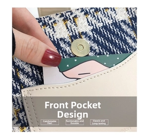 Detail of front pocket with tweed fabric, beige leather trim and gold magnetic closure