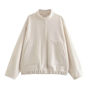 Detail of off-white fleece jacket featuring standing collar and large front pockets