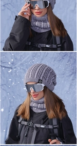 Close-up of winter knit hat and neck warmer set in gray fleece-lined cable knit fabric