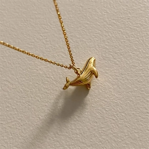 Minimalist 925 sterling silver whale pendant necklace with textured gold finish