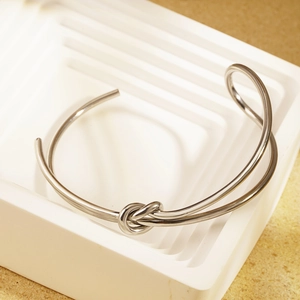 Minimalist silver knot open bangle in polished 18K gold plated stainless steel