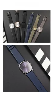 Detailed close-up showing a collection of minimalist ultra-thin leather strap quartz watches