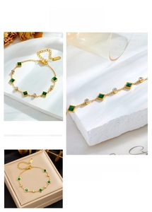 Detail of emerald cut green zircon bracelet with gold finish and S.Steel logo tag