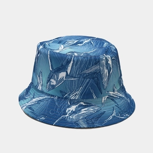 Blue reversible bucket hat with all-over shark print for summer outdoor sun protection