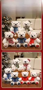 Collection of white polar bear plush toys in festive Christmas scarves and winter outfits
