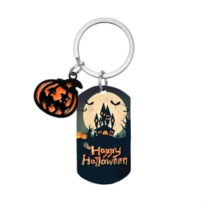 Halloween pumpkin and castle keychain with Happy Halloween text on white background