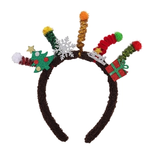 Detail of Christmas headband with plush tree, gift box and Merry Christmas sign