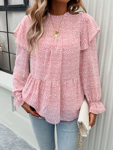 Detail of pink leopard print blouse showing ruffled stand collar and elegant shoulder frills