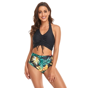 Two-piece halter bikini set featuring black drawstring top and tropical floral print bottoms