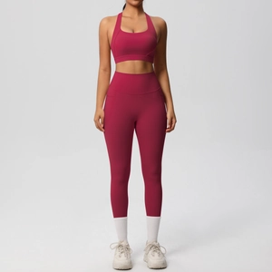 Detail of high-waisted yoga leggings with side pockets and shockproof sports bra set