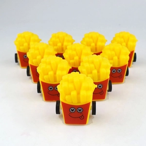 Detailed view of ten cartoon french fries pull-back toy cars with cute expressions