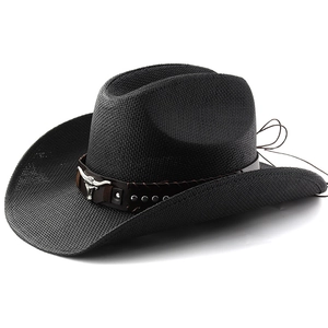 Detailed view of black straw cowboy hat with leather band and silver bull skull ornament