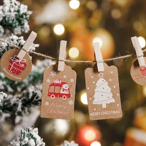 Christmas kraft paper gift tags with Merry Christmas prints and rustic wooden clips