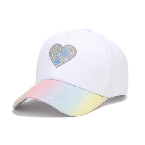 Close-up of kids white cotton baseball cap with rainbow brim and glitter heart patch