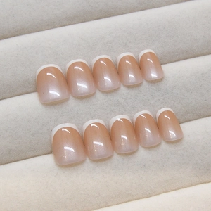 French tip press-on nails in pearlescent nude pink with short square oval shape