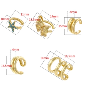 Set of five gold-plated star and bow ear cuffs with dimensions from 10mm to 16.5mm