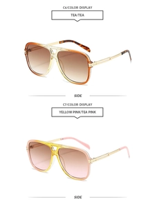 Detail view of stylish pilot sunglasses with tea and yellow-pink gradient lenses