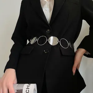 Silver oval link waist chain with polished rings on a black blazer for chic styling