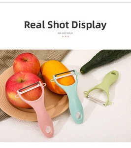 Detail of Y-shaped ceramic peelers in pink, blue, and green with ergonomic handles