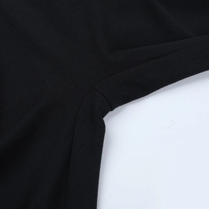 Macro shot of precise stitching and high-quality seam detail on black lace bodysuit fabric