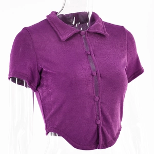 Detail view of purple ribbed crop top featuring polo collar and buttoned cardigan design