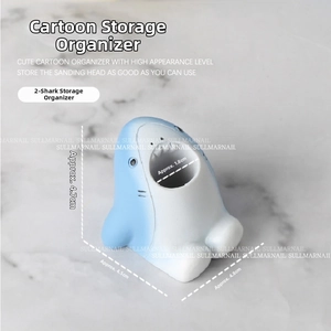 Blue shark-shaped resin organizer detail showing top slot for nail drill bits