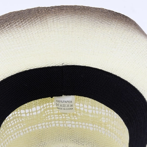 Macro detail of paper straw weave and inner sweatband with 100% paper material label