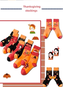 Detail of assorted Thanksgiving knit mid-calf socks with festive holiday patterns