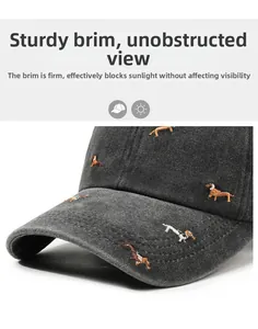 Close-up of dark grey washed cotton baseball cap with puppy embroidery and curved brim