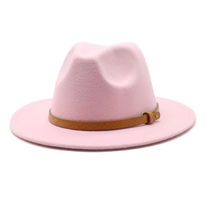 Detail of pink wool fedora hat featuring a brown snake print leather band with gold buckle