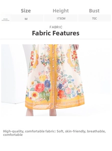 Macro detail of the floral print fabric and yellow wavy trim on the vintage maxi skirt