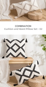 Detail of cream tufted cushion set with black geometric patterns and tassels