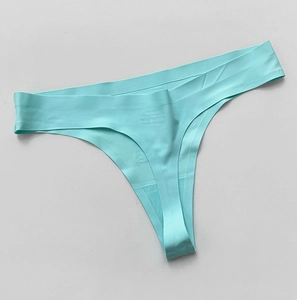 Close-up of mint green seamless thong with cartoon graphic and flat laser-cut edges