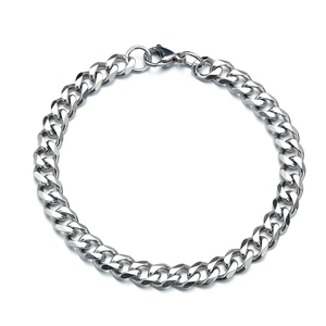 Detailed view of silver stainless steel Cuban link bracelet with lobster clasp closure