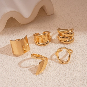 Five-piece set of gold geometric chunky rings featuring irregular and spiral minimalist designs