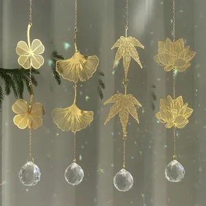 Garden suncatchers with metal leaf motifs and faceted crystal prisms for rainbow effects