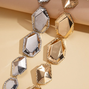 Metallic irregular faceted geometric chain in gold and silver with a high-shine finish