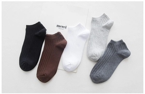 Detailed flat lay of five pairs of ribbed cotton ankle socks in neutral earthy tones