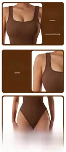 Detailed view of the dark brown ribbed fabric and deep U-neck of the yoga bodysuit