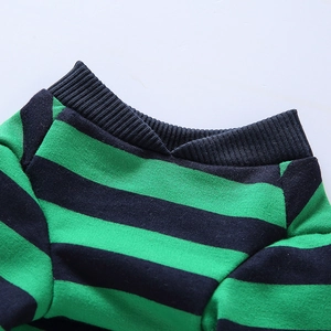 Detailed close-up of the green and black striped ribbed knit neckline on dog pajamas