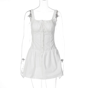 Detail of white slim fit mini dress with drawstring ruching and decorative buttons