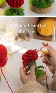 Macro detail of DIY hand-knitted red rose crochet set with soft yarn and wooden base